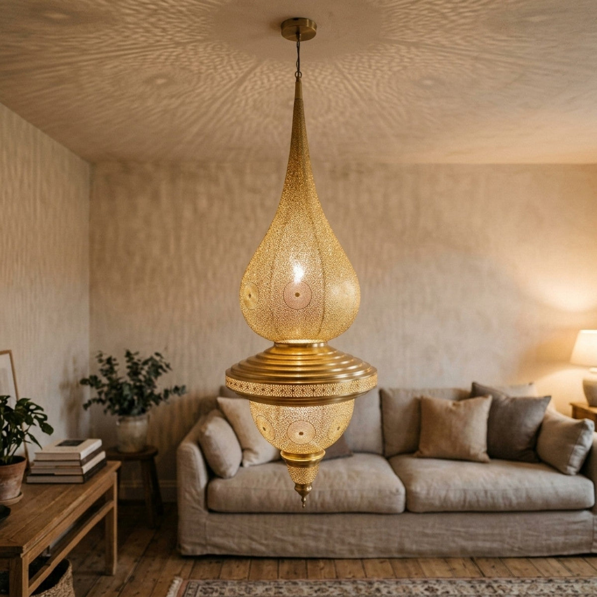 Handcrafted Moroccan double teardrop brass pendant lights shown in an interior setting