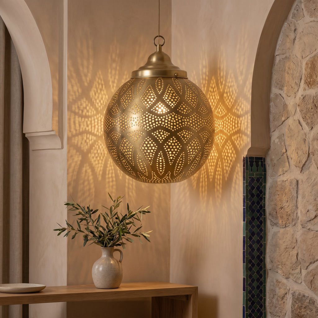 Moroccan brass pendant light installed in an arched interior