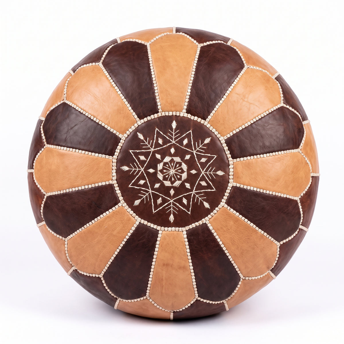 Top view of a tan and dark brown leather pouf with white star embroidery