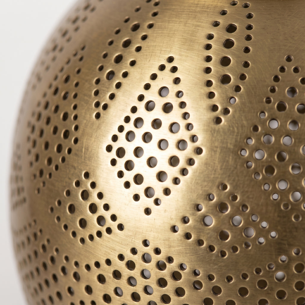 Detailed side close-up of the hand-pierced brass filigree pattern