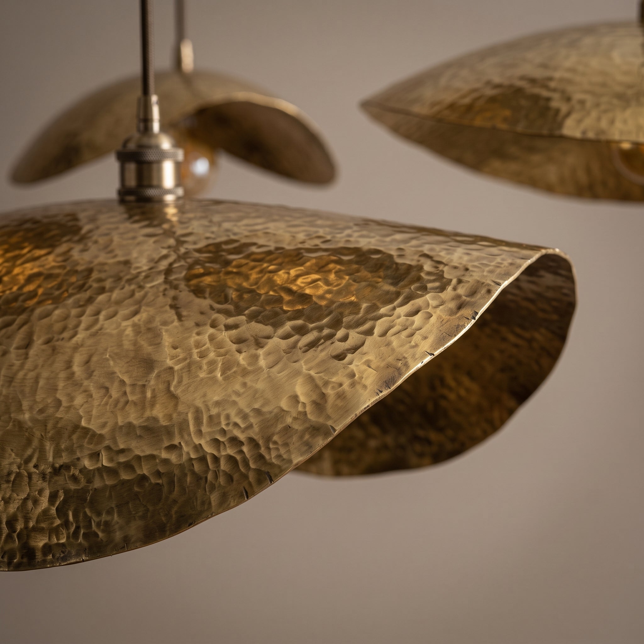 Detailed view of the hammered brass surface on a pendant shade