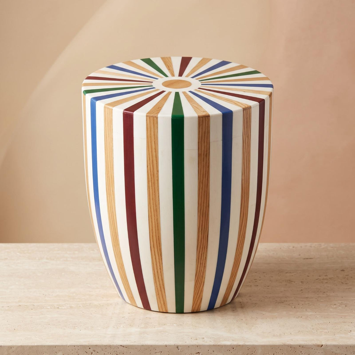 Multicolored striped wooden drum stool with a radial sunburst top