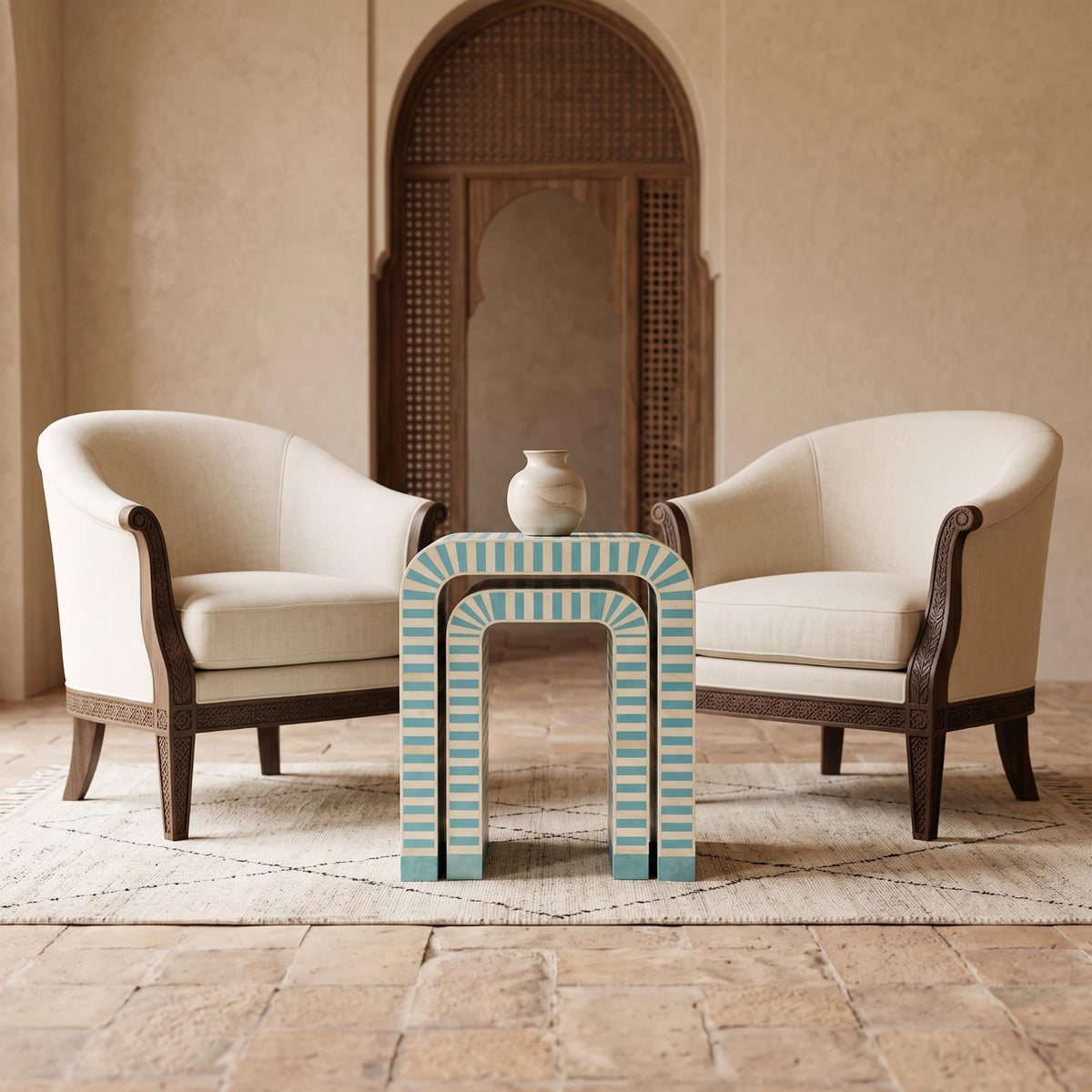 Turquoise and cream striped arch side table between two cream upholstered chairs