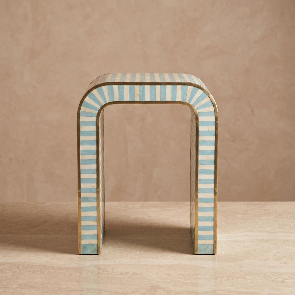 Turquoise and cream arch side table with an open rounded doorway-shaped center