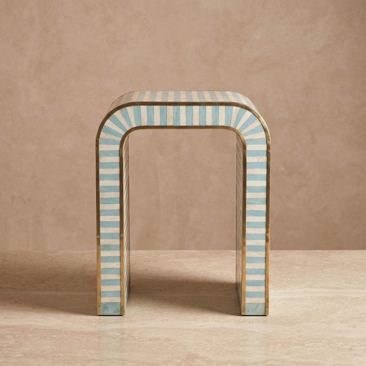 Turquoise and cream arch side table with an open rounded doorway-shaped center