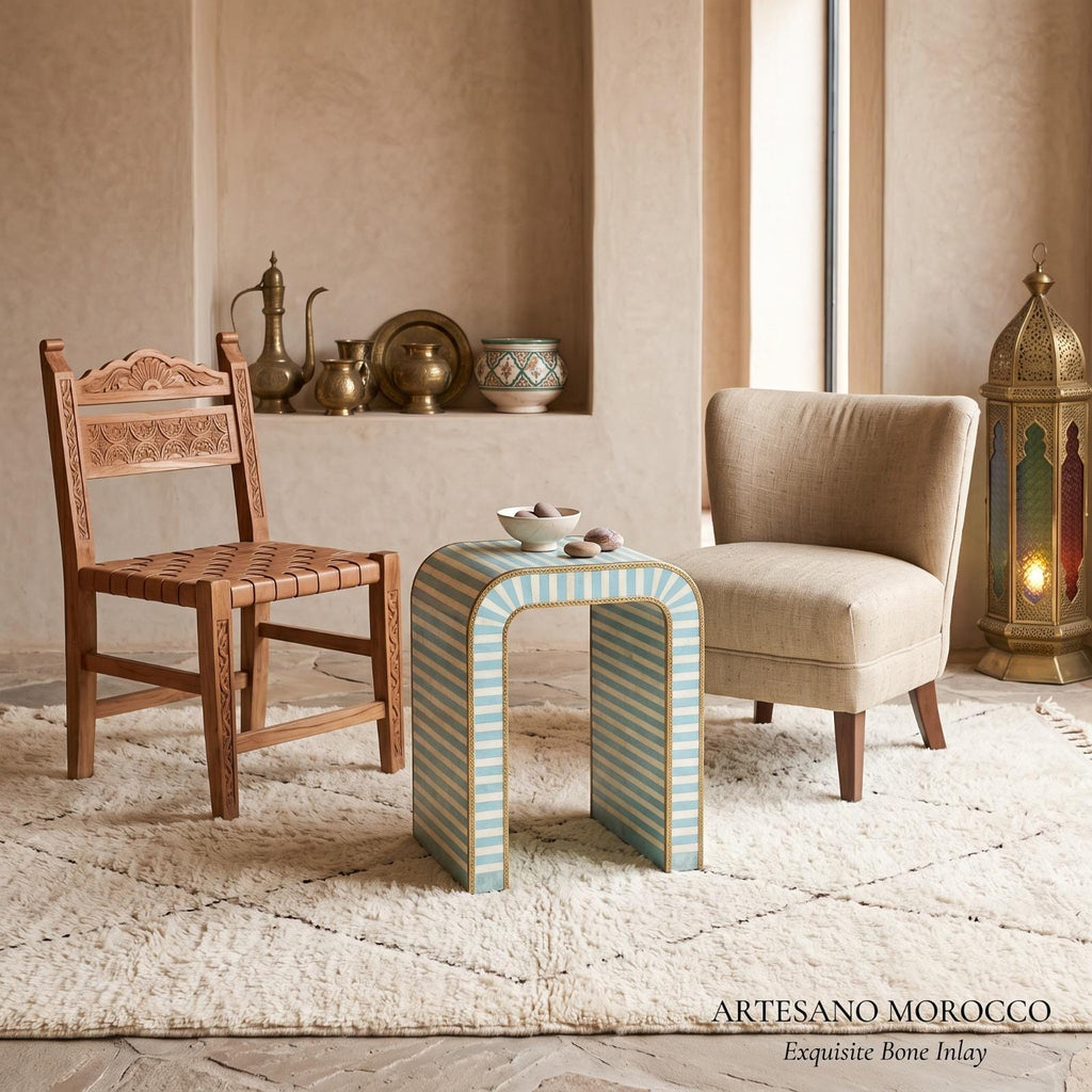 Turquoise striped arch side table with a tea set between wooden and cream lounge chairs