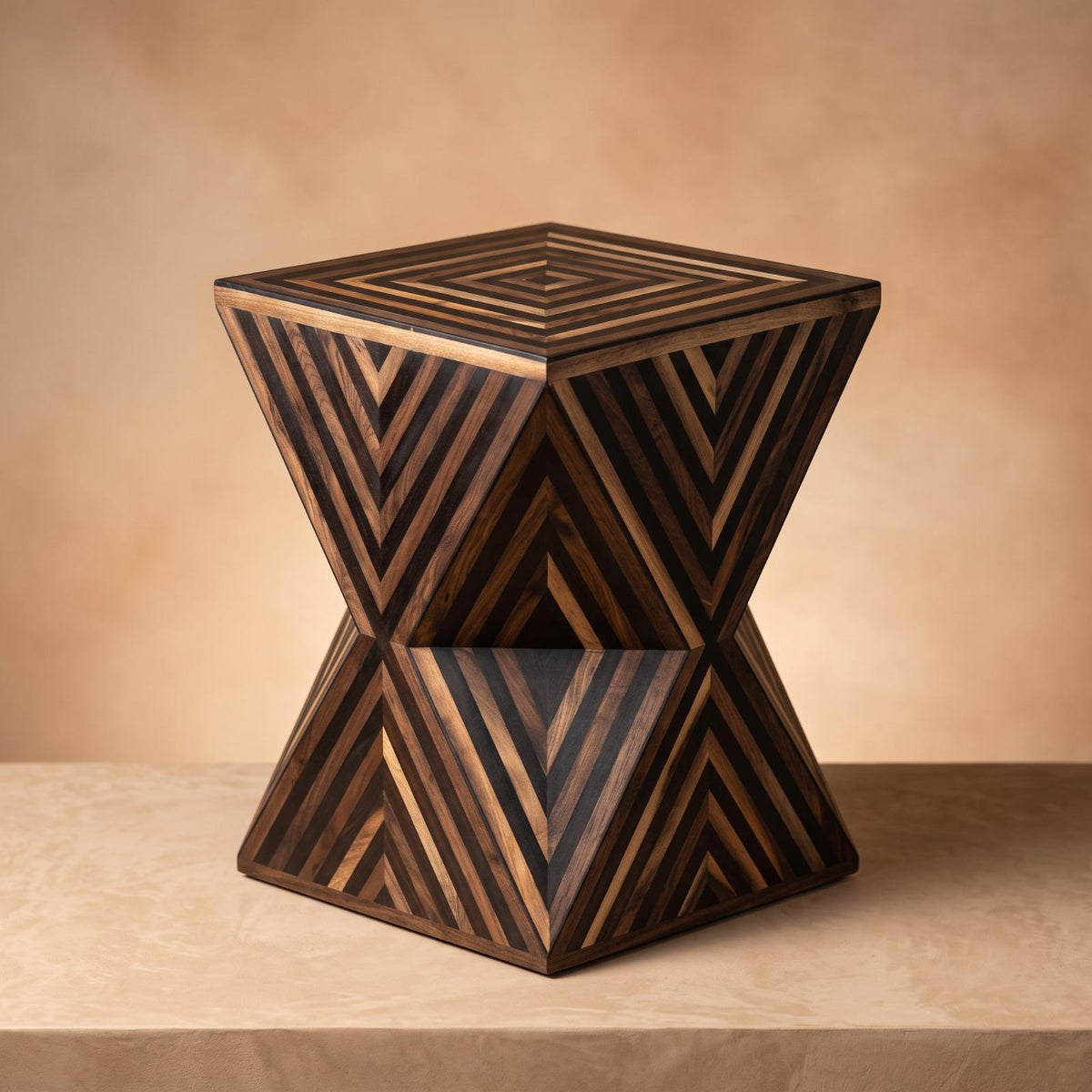 Dark wood hourglass table with contrasting geometric stripes against a warm beige wall