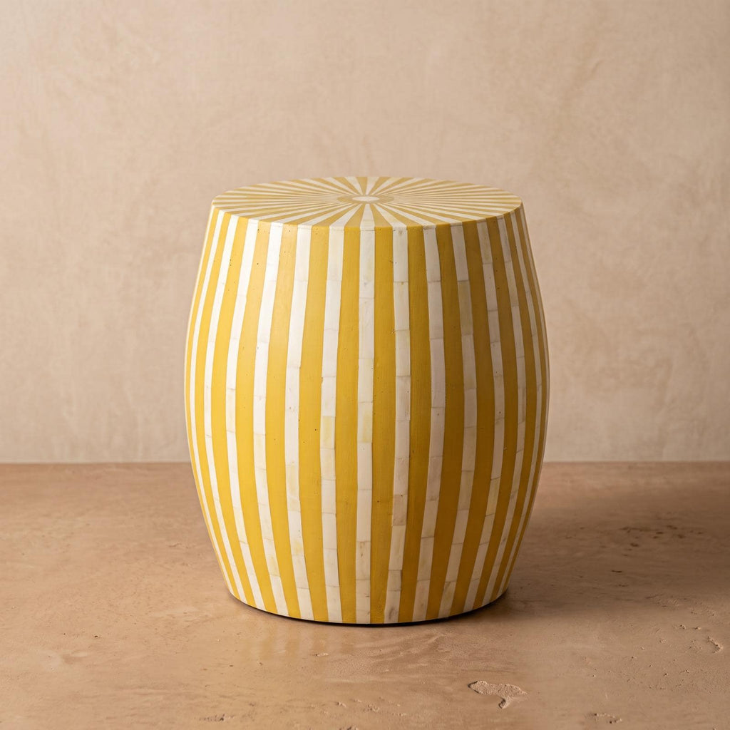 Yellow and cream striped wooden drum table showing its curved sides and radial top