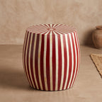 Red and cream striped drum side table showing its radial sunburst top