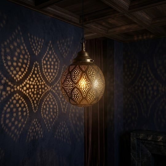 Rounded brass globe with repeating diamond-shaped panels filled with dotted perforations.