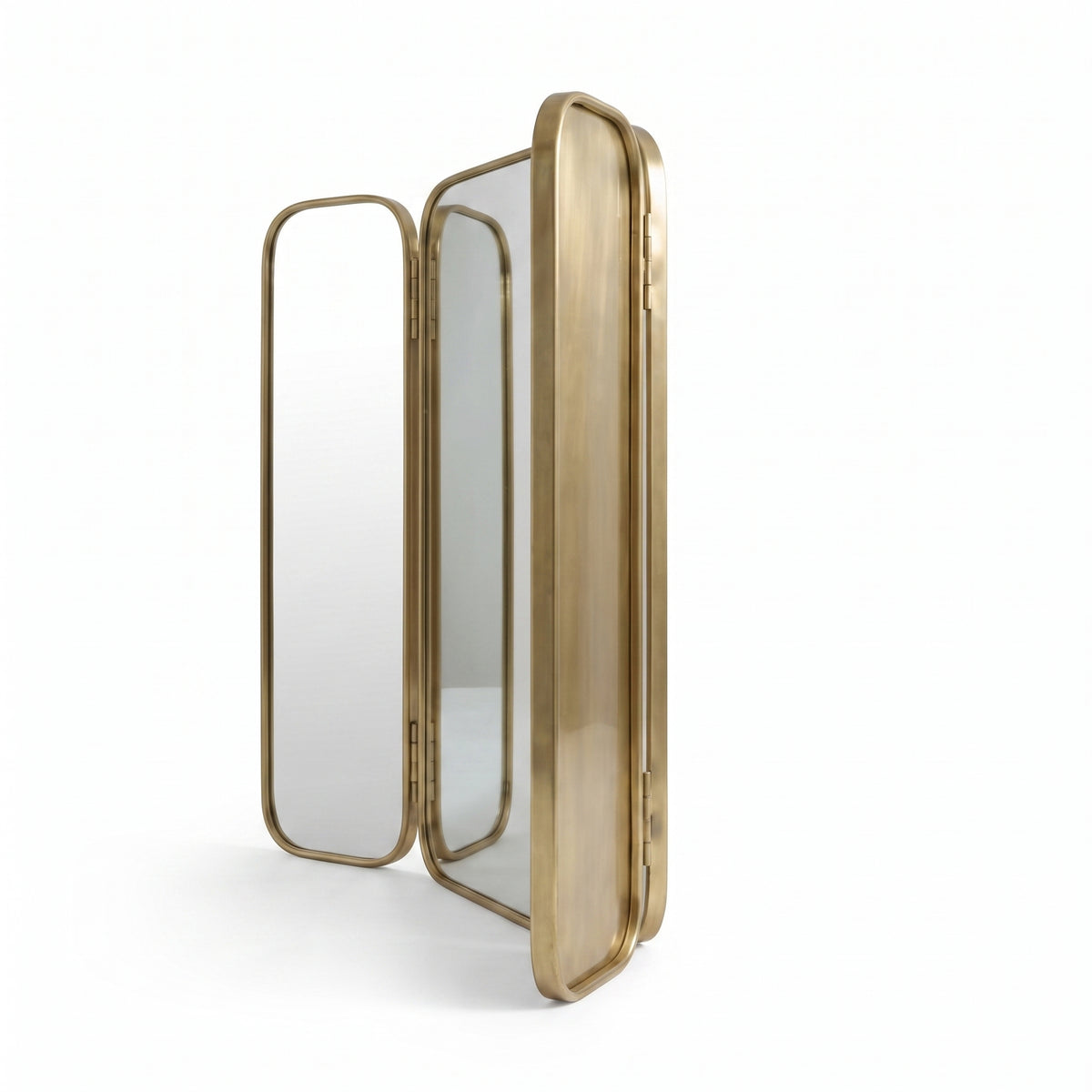 Side view of Moroccan brass triptych mirror with folding panels partly open against a white background
