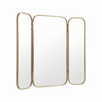 Moroccan brass triptych wall mirror with gold frame and three panels fully open against a white background