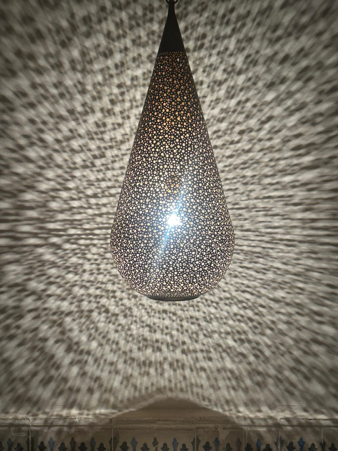 NEOMEDINA Moroccan perforated teardrop pendant casting decorative shadows