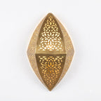 Front view of a faceted teardrop brass wall sconce with pierced floral panels