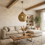 Diamond Lattice brass globe pendant above a coffee table in a bright living room