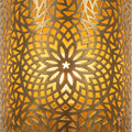 Close-up of a Moroccan brass wall sconce with pierced floral rosette and geometric patterns
