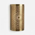 Curved brass wall sconce with two pierced sunflower medallions