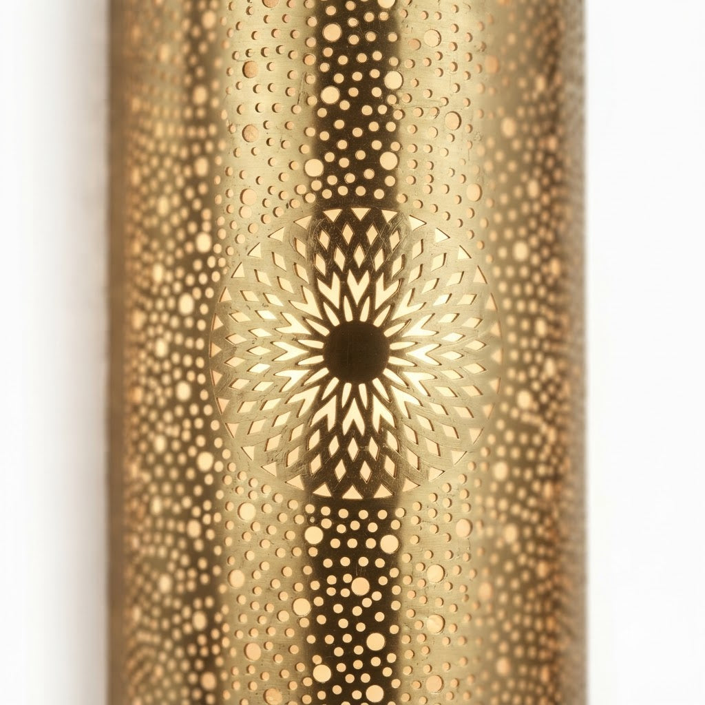 Illuminated twin sunflower medallions on a curved Moroccan brass wall sconce