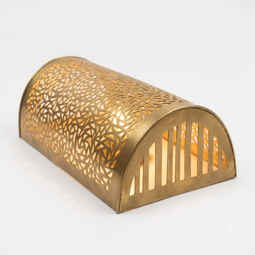 Angled view of a curved Moroccan brass wall sconce showing its open end and pierced metal