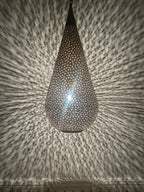 Moroccan Perforated Teardrop Pendant with a perforated brass teardrop silhouette