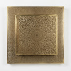 Front view of a square brass wall light with a central rosette and densely pierced border