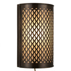 Dark brass wall sconce with a curved face and repeating lattice cutouts