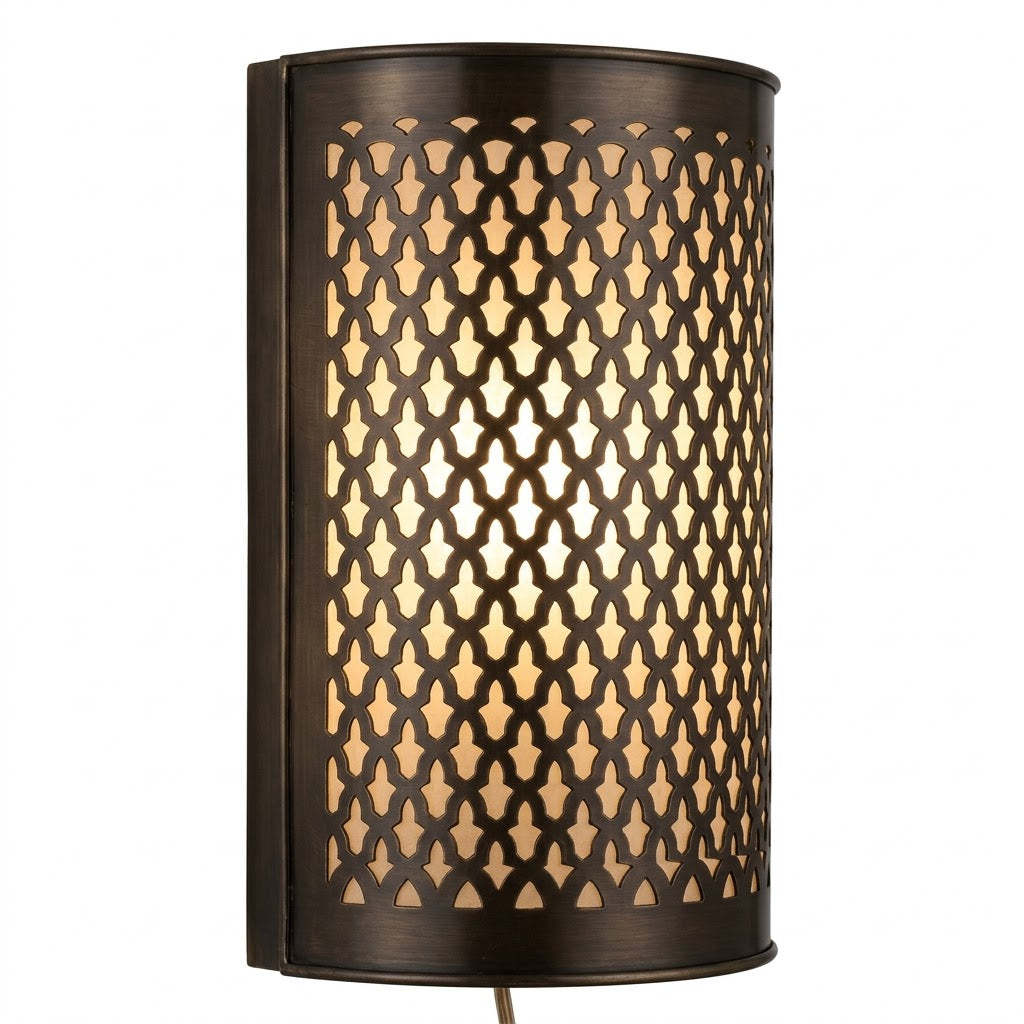 Dark brass wall sconce with a curved face and repeating lattice cutouts