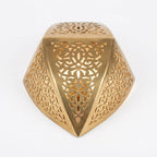 Angled view of a gold-toned faceted teardrop wall sconce with an open top