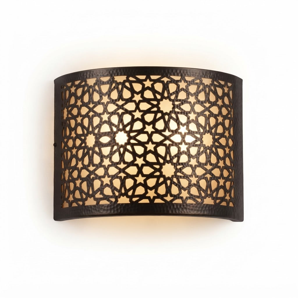 Front view of a wide curved Moroccan brass wall sconce with star lattice cutouts