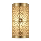 Front view of a gold-toned brass wall sconce with a pierced floral rosette