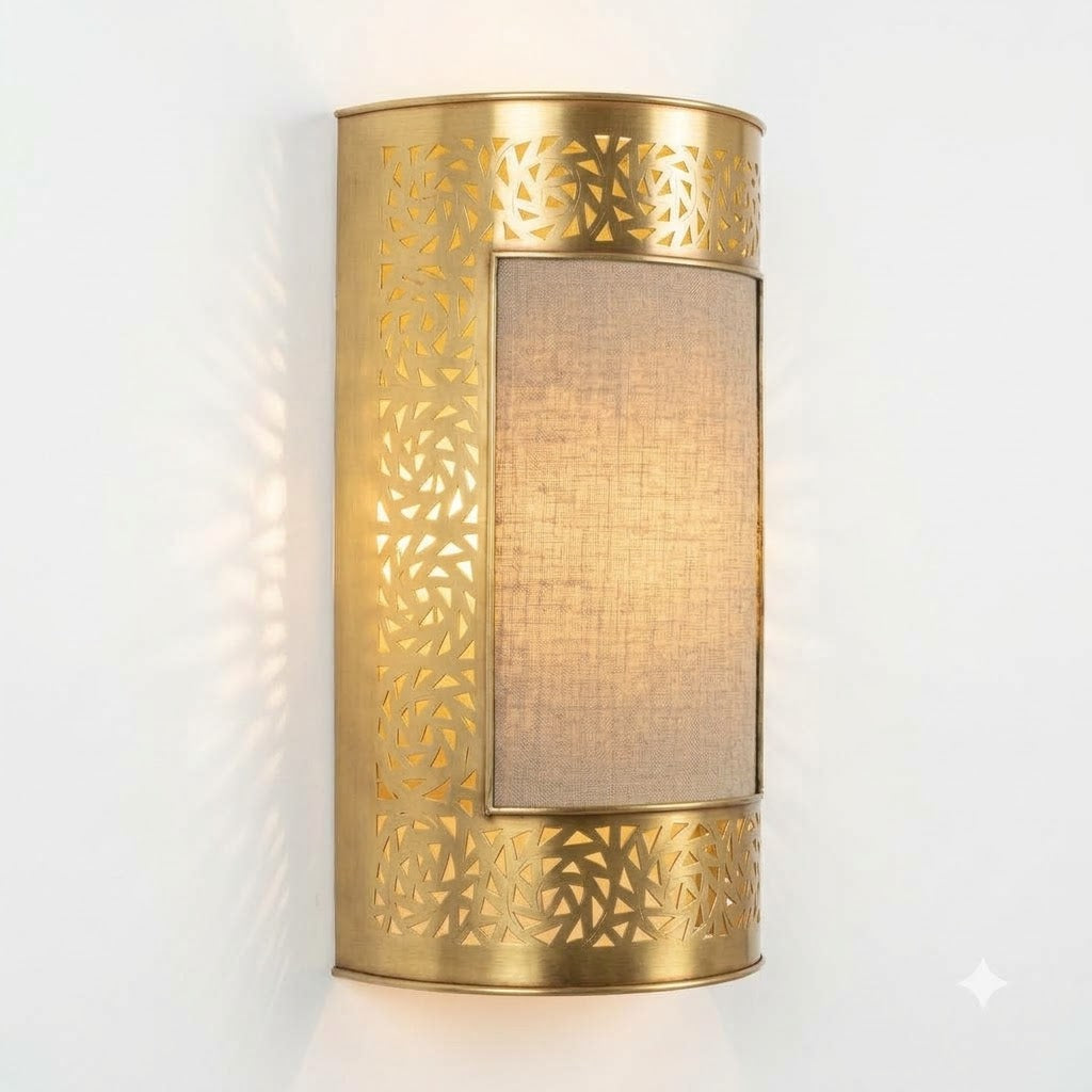 Illuminated brass wall sconce with a rectangular central panel and pierced geometric borders