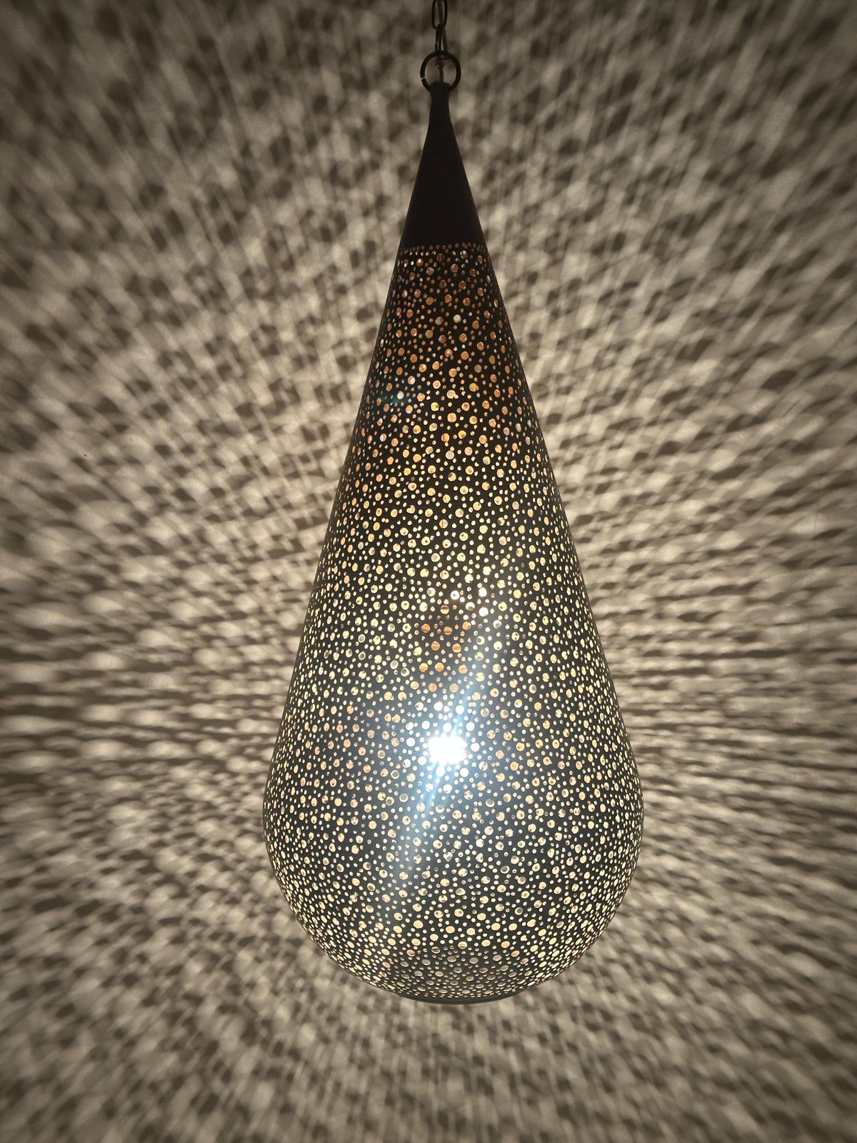 Moroccan Perforated Teardrop Pendant with a perforated brass teardrop silhouette
