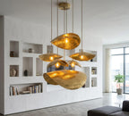 Hammered Brass Petal Pendant Light with curved hammered brass petals